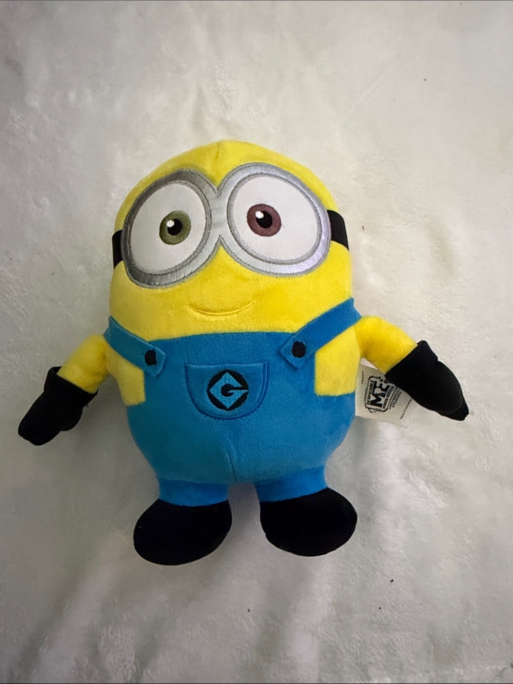 Universal Yellow Plush Minion with Blue Overalls and Mismatched Eyes